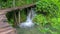 The wooden park pathways enjoying the view of emerald lakes, cascades and crystal clear water, Plitvice Lakes National Park,