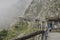 Wooden passage in a rocky foggy landscape