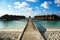 Wooden path bridge to the exotic and luxurious water villa bungalows