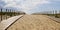 Wooden path coast access with sand beach waves entrance to ocean atlantic sea in cap-ferret france