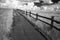 Wooden Path With Railing and Dramatic Cloudscape