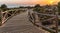 Wooden path to sea during sundown