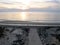 Wooden pathway access atlantic ocean sunset in Lacanau beach France