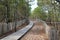 Wooden pathway coast access sand beach entrance to ocean atlantic sea in france