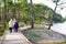 Wooden pathway family tourist in hourtin beach lake sea of Maubuisson Carcans France