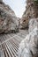 Wooden pathway with rock valley or cliff on the island