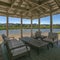 Wooden patio overlooking lake and houses in Utah