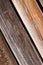 Wooden pattern consists of inclined boards light brown closeup