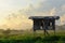 Wooden pavilion surrounding by paddy field