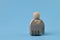 Wooden people figure and padlock isolated on a blue background. Cybersecurity protection from hackers attack and save clients