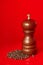 Wooden pepper mill with black peppercorn