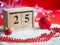 Wooden perpetual calendar set on 25 of December with Christmas d