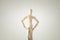 wooden person standing with his back looking at empty white space concept