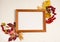 Wooden photo frame, yellow oak leaves, red maple leaves, Rowan fruits, hawthorn, acorns on white background.