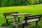 Wooden picnic bench on a green meadow in Zamecky Park, in Hluboka Castle, Hluboka nad Vltavou Czech Republic