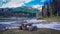 Wooden picnic benches on the background of the snow-capped mountains of Abkhazia