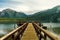 Wooden pier on a beautiful lake and the Andes mountain range in the background. Alerces National Park. Chubut, Argentina