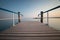 Wooden pier with blue railing