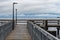 The wooden pier at Bonnabel Park in New Orleans offers a stormy view over the water