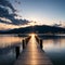 a wooden pier or jetty on the blue lake.