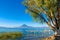 Wooden pier at Lake Atitlan on the shore at Panajachel, Guatemala.  With beautiful landscape scenery of volcanoes Toliman, Atitlan