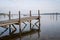 Wooden pier in the lake in the morning