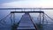 Wooden pier on the lake shore. Twilight. Peace and tranquility.