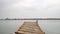 Wooden pier on lake, zooming