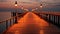 Wooden pier with lanterns at sunset in the evening time