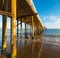 Wooden pier in Malibu beach seen from below