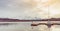 Wooden pier and moored yacht. Serenity and calm landscape.