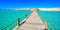 Wooden Pier at Orange Bay Beach with crystal clear azure water and white beach - paradise coastline of Giftun island, Mahmya,