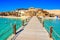 Wooden Pier at Orange Bay Beach with crystal clear azure water and white beach - paradise coastline of Giftun island, Mahmya,