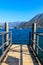 Wooden pier overlooking the Alps and Lake Como, Italy