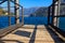 Wooden pier overlooking the Alps and Lake Como, Italy