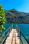 Wooden pier overlooking the Alps and Lake Lugano, Switzerland