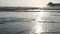 Wooden pier on piles, silhouette at sunset, California USA, Oceanside. Sunny sea waves at sundown.