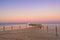 Wooden Pier on Red Sea in Hurghada at sunset and luxury yacht, View of the promenade boardwalk - Egypt, Africa