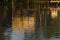 Wooden pier reflected in moving water in the Tigre Delta, in Argentina