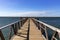 Wooden pier on the sea a sunny day with blue sky