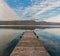 Wooden pier and Towada lake in autumn season.