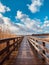 Wooden pier at waterside - straight wood dock walkway at lake