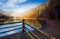 Wooden pierce fence on a lake in fog