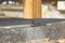 Wooden pillar on the construction site concrete with screw. Wooden Pillars are structures that can be placed on Foundations or Pl