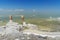 Wooden pillars with crystallized salt on Urmia Salt Lake. Iran