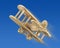 Wooden plane in the blue sky