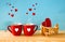 Wooden plane with heart next to couple of coffe cups