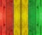 Wooden plank with reggae colour background