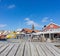 Wooden planks in foreground and typical Swedish colorful village