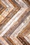 Wooden planks herringbone wall  peeling paint background